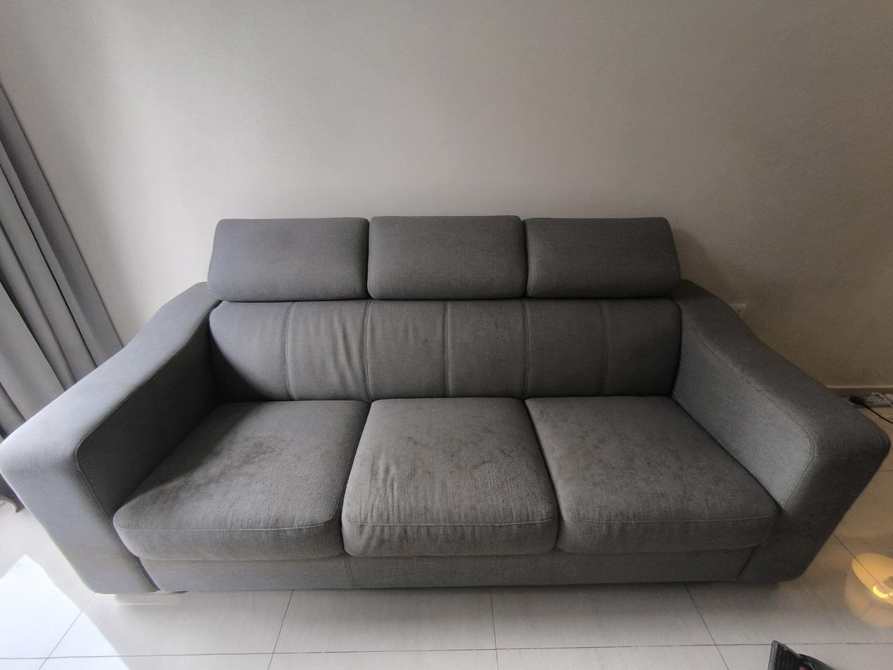 Grey sofa before cleaning